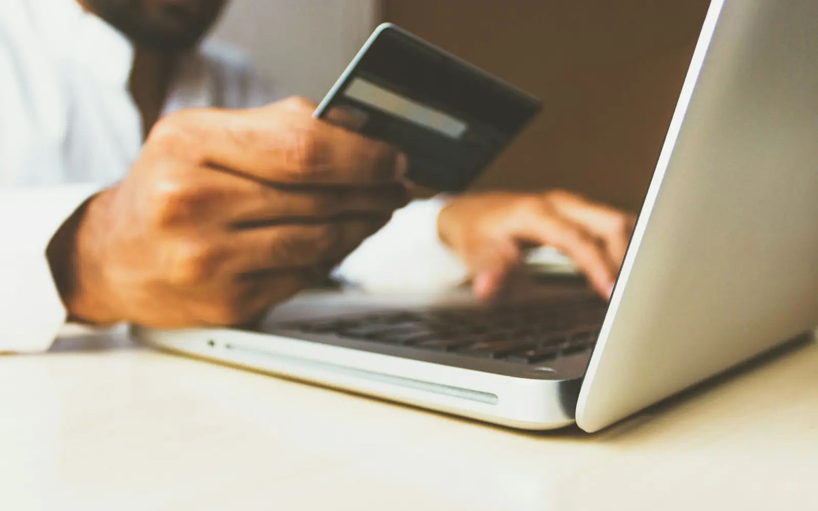 A customer making a secure online payment on a laptop